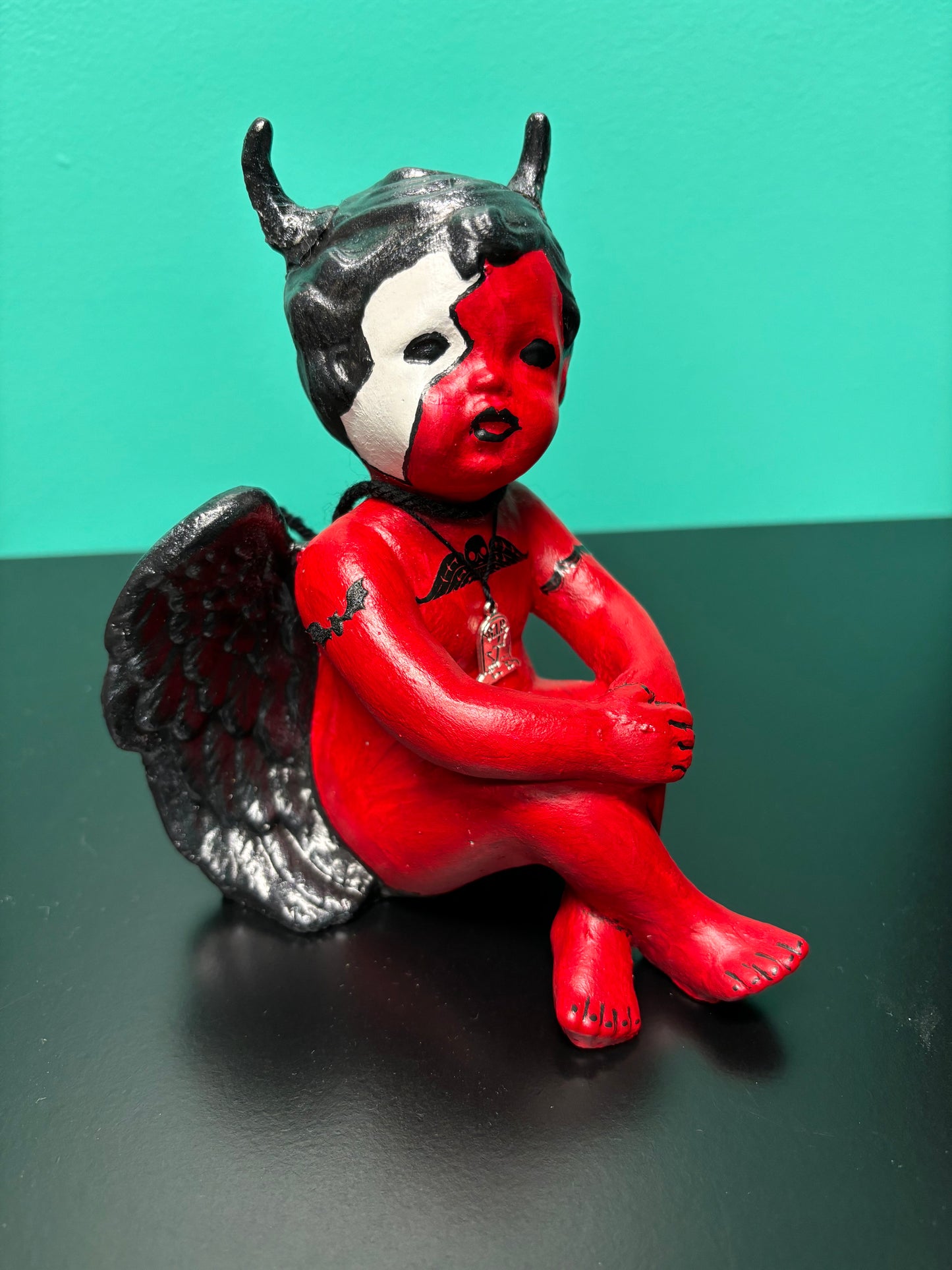 Red and Black Cherub Demon