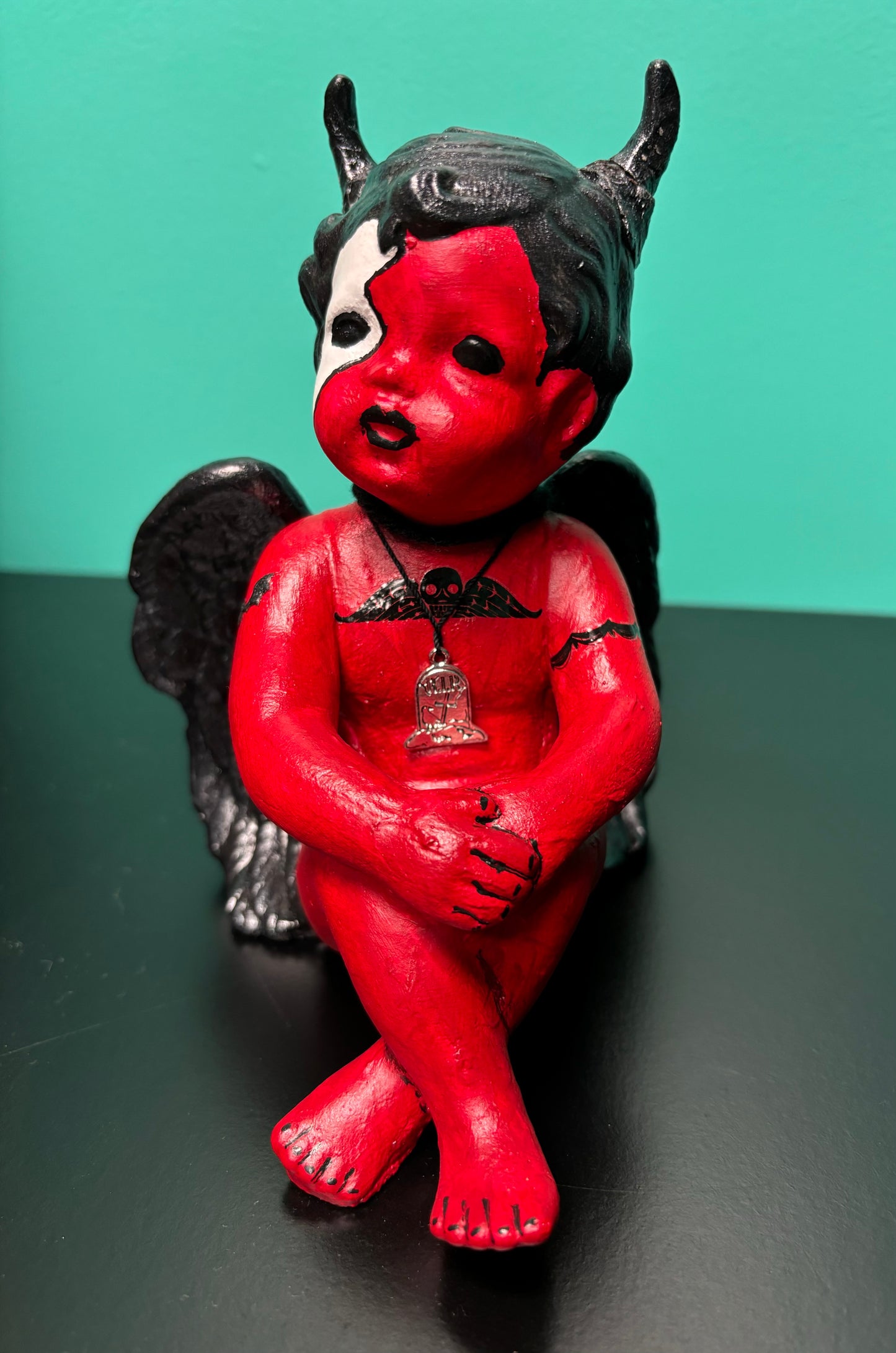 Red and Black Cherub Demon